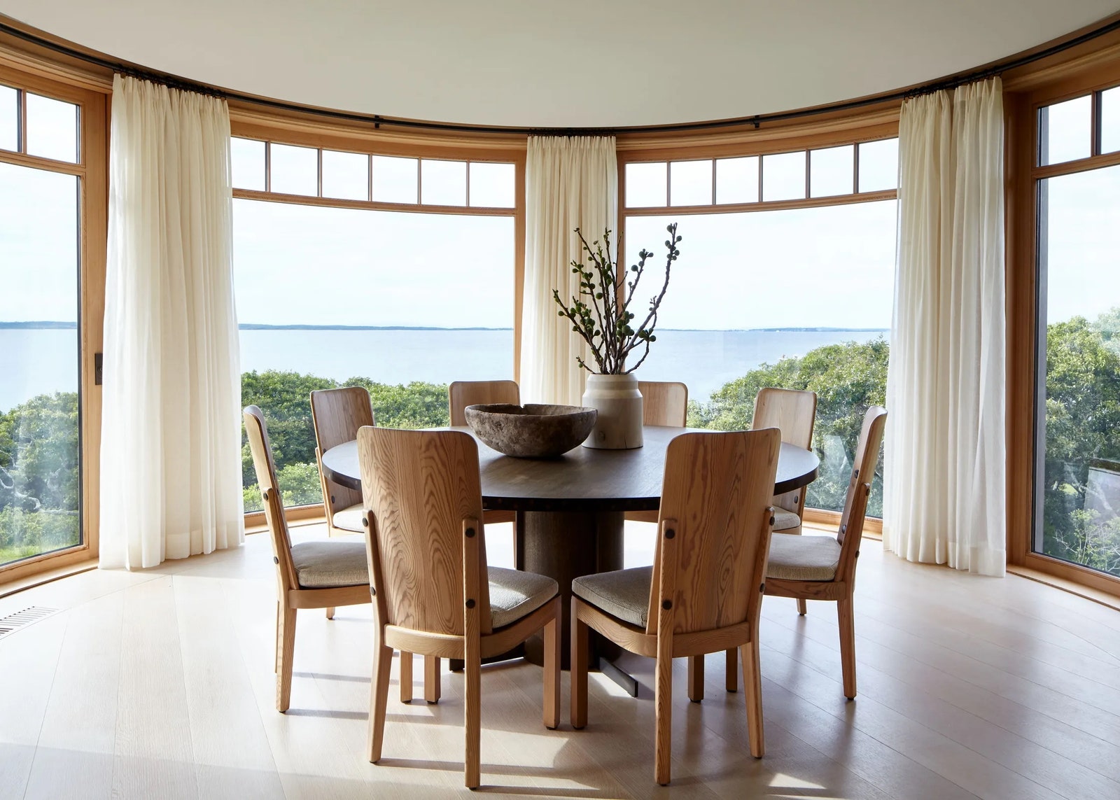 For a project on an island off the coast of New England Terri Ricci interiors surrounded a custom dining table with...