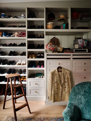 dressing room walk in closet with shoe shelves