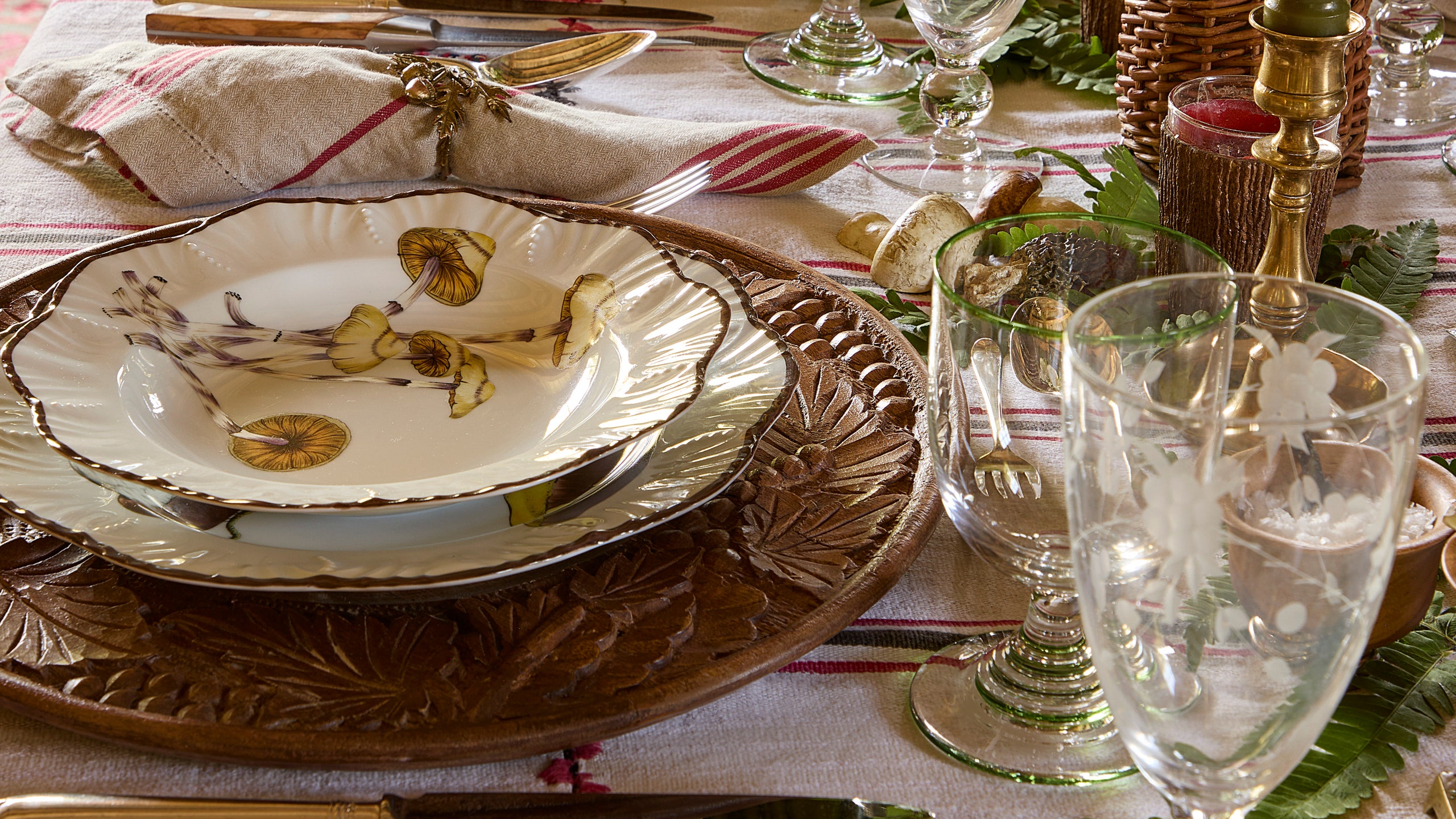 A Wisconsin table set with mushroom plates by Alberto Pinto on a vintage French linen tablecloth.