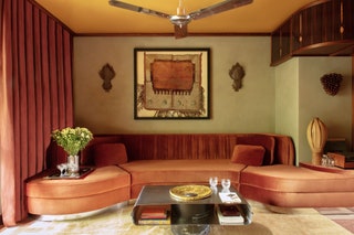 Living room curved velvet couch chrome ceiling fan
