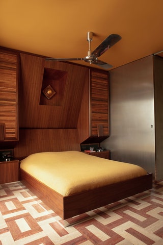 bedroom large walltowall unit encompassing headboard and bedside table